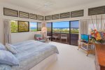 The master bedroom features stunning ocean and island views